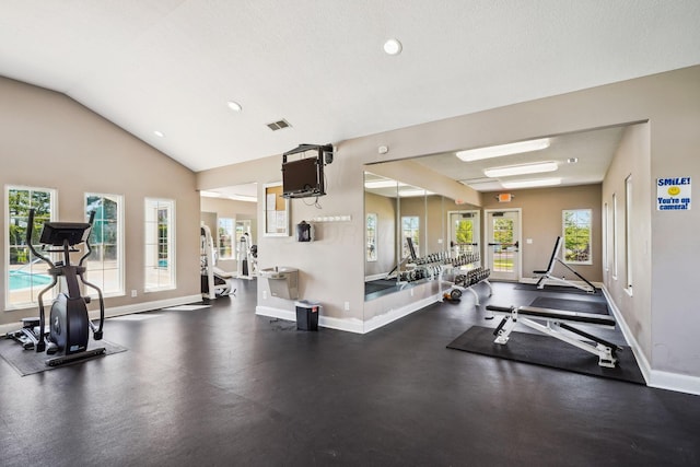 exercise room with baseboards, recessed lighting, and lofted ceiling