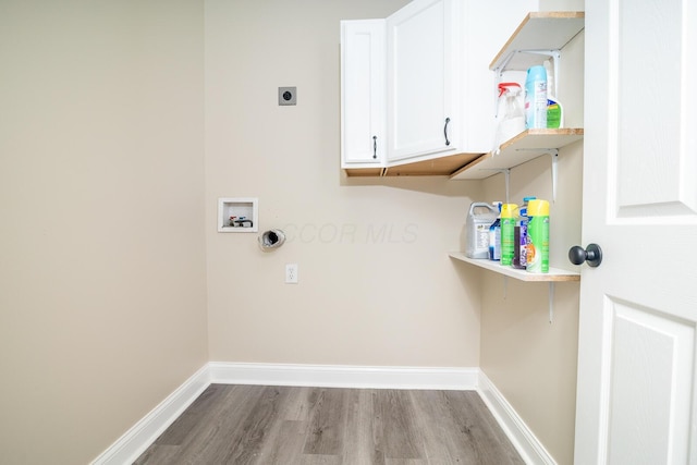 7885 Upper Twin Rd, South Salem, OH 45681 - laundry room featuring hookup for an electric dryer, wood finished floors, hookup for a washing machine, baseboards, and cabinet space