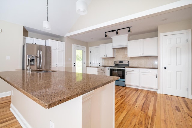 7885 Upper Twin Rd, South Salem, OH 45681 - kitchen with stainless steel appliances, light wood-style floors, white cabinets, and tasteful backsplash