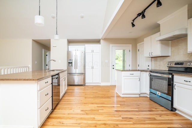 7885 Upper Twin Rd, South Salem, OH 45681 - kitchen with stainless steel appliances, a sink, under cabinet range hood, track lighting, and decorative backsplash