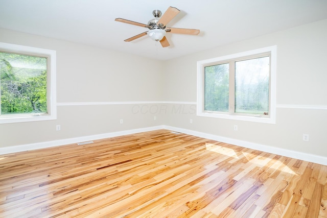 7885 Upper Twin Rd, South Salem, OH 45681 - unfurnished room with wood finished floors, ceiling fan, and baseboards