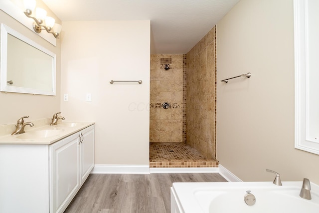 7885 Upper Twin Rd, South Salem, OH 45681 - full bath with wood finished floors, tiled shower, a bath, and baseboards