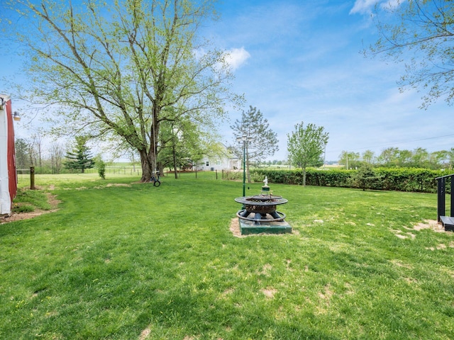 7677 Opossum Run Rd, London, OH 43140 - view of green lawn featuring an outdoor fire pit