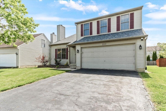 269 Rainswept Dr, Galloway, OH 43119 - traditional home with driveway, an attached garage, and a shingled roof