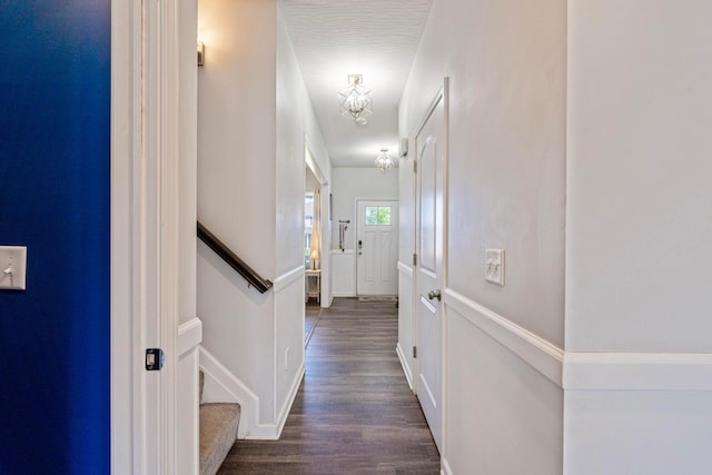 331 Hardwood Ave, Circleville, OH 43113 - hall featuring dark wood-type flooring, baseboards, and an upstairs landing