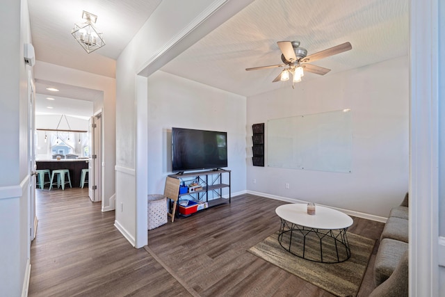 331 Hardwood Ave, Circleville, OH 43113 - living area with wood finished floors, a ceiling fan, baseboards, and a chandelier