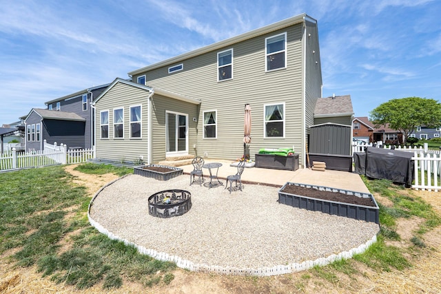331 Hardwood Ave, Circleville, OH 43113 - back of house featuring a fire pit and a patio