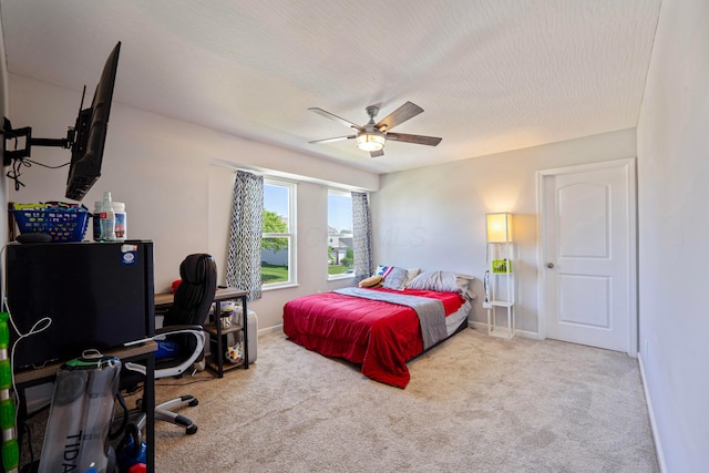 331 Hardwood Ave, Circleville, OH 43113 - carpeted bedroom with a desk, a ceiling fan, and baseboards