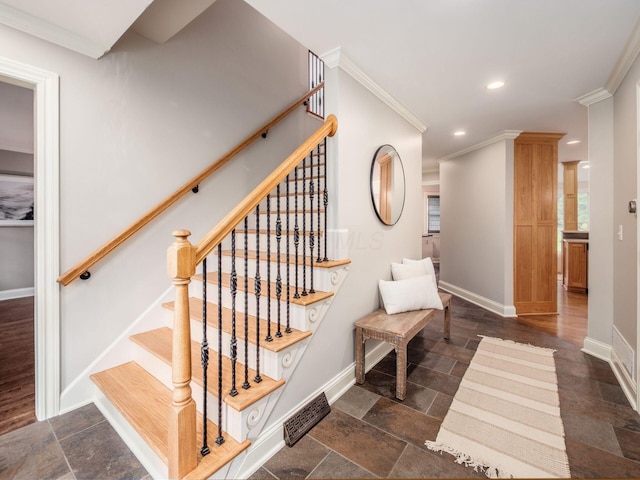 staircase featuring ornamental molding, baseboards, recessed lighting, and stone finish floors