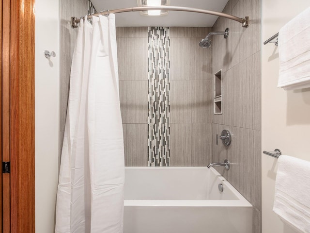 bathroom featuring shower / bathtub combination with curtain