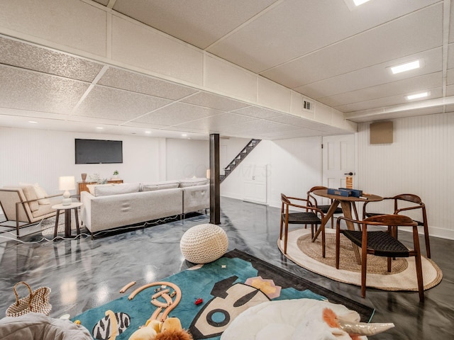 game room with finished concrete floors