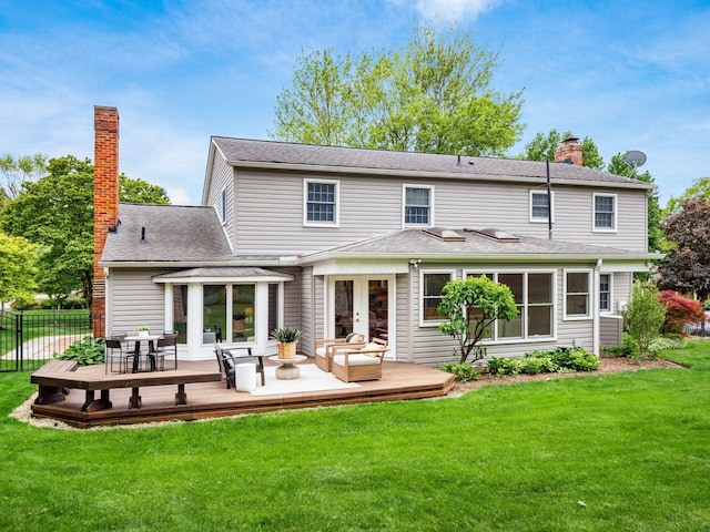 rear view of house with a wooden deck, a chimney, outdoor lounge area, and french doors