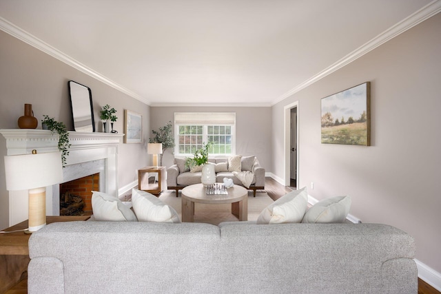 living area featuring ornamental molding, wood finished floors, baseboards, and a high end fireplace