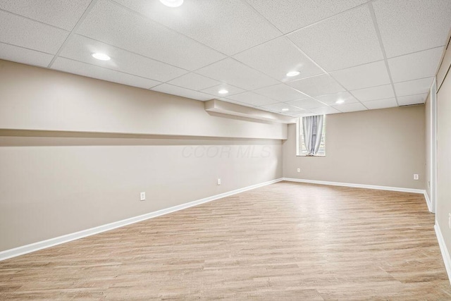 8950 Woodhaven Rd, Johnstown, OH 43031 - basement with baseboards, wood finished floors, recessed lighting, and a drop ceiling