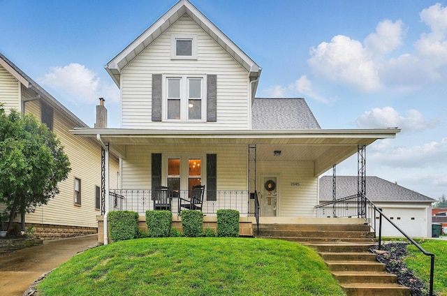 1545 Westwood Ave, Columbus, OH 43212 - view of front of home with a porch, a front lawn, and a garage