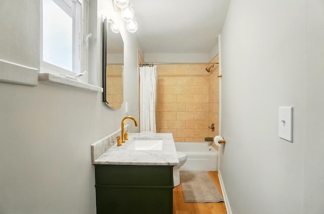 1545 Westwood Ave, Columbus, OH 43212 - bathroom featuring vanity, wood finished floors, toilet, and shower / tub combo with curtain