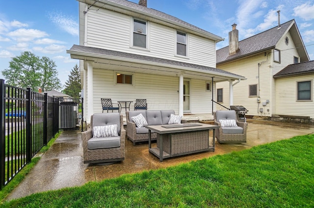 1545 Westwood Ave, Columbus, OH 43212 - back of property with a patio area, an outdoor hangout area, and a chimney