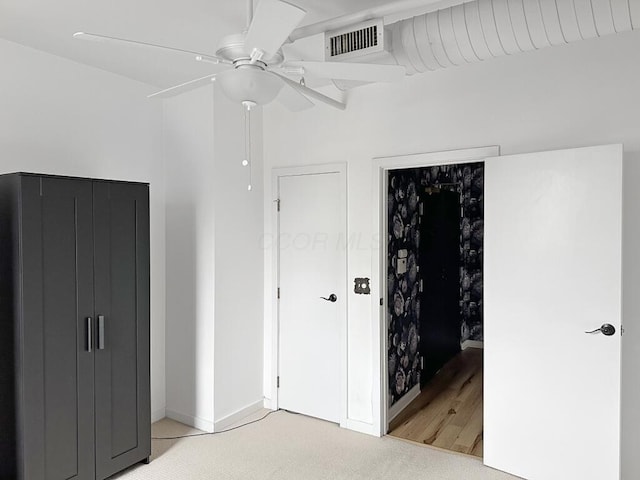 432 E Rich St Unit 3K, Columbus, OH 43215 - unfurnished bedroom with light colored carpet, ceiling fan, and baseboards