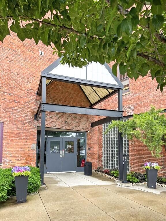 432 E Rich St Unit 3K, Columbus, OH 43215 - view of home's exterior with french doors and brick siding