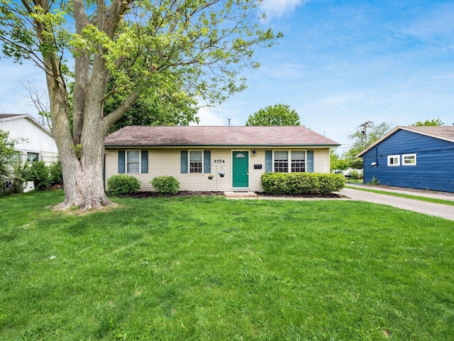 ranch-style home with a front yard