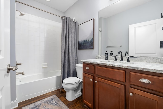 243 Parkgate Ct, Delaware, OH 43015 - full bath with wood finished floors, vanity, toilet, and shower / bath combo with shower curtain