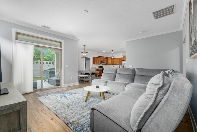 243 Parkgate Ct, Delaware, OH 43015 - living area featuring ornamental molding, light wood-type flooring, and baseboards