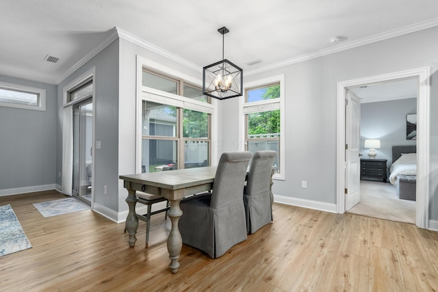 243 Parkgate Ct, Delaware, OH 43015 - dining space featuring a chandelier, light wood-type flooring, ornamental molding, and baseboards