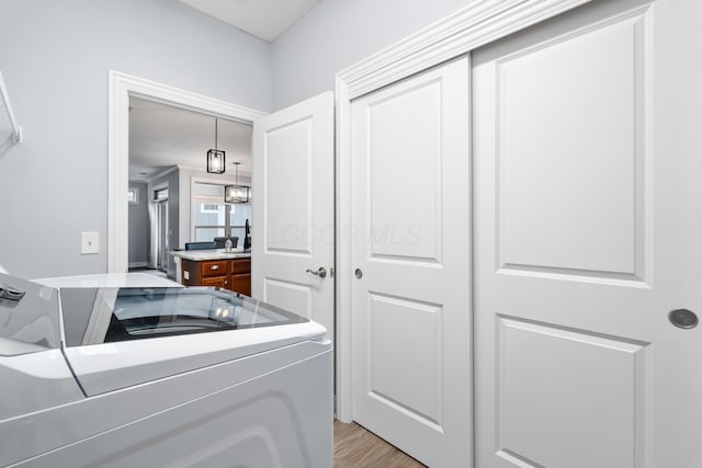 243 Parkgate Ct, Delaware, OH 43015 - washroom featuring washer and clothes dryer and light wood-style flooring