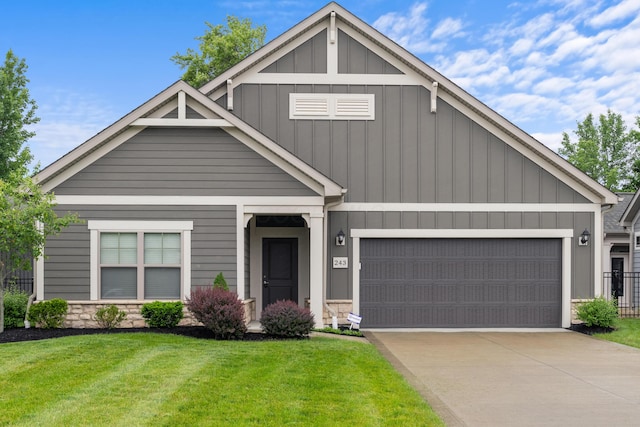 243 Parkgate Ct, Delaware, OH 43015 - craftsman-style home featuring board and batten siding, an attached garage, a front lawn, concrete driveway, and stone siding