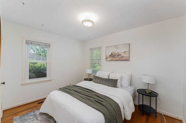 832 Oxley Rd, Columbus, OH 43212 - bedroom with multiple windows, wood finished floors, and baseboards