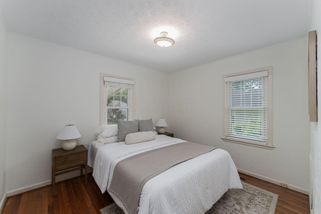 832 Oxley Rd, Columbus, OH 43212 - bedroom featuring wood finished floors, baseboards, and a textured ceiling