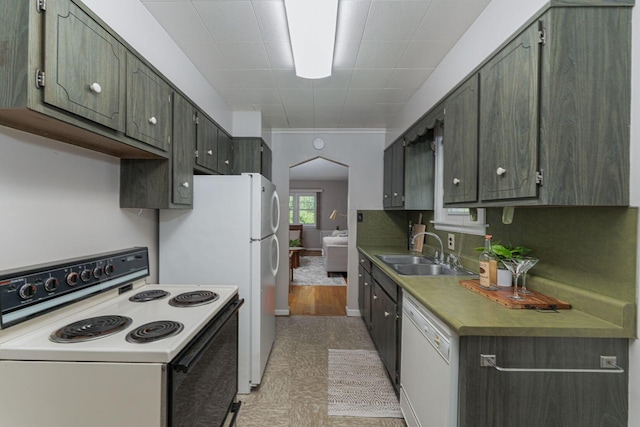 832 Oxley Rd, Columbus, OH 43212 - kitchen featuring white appliances, a sink, and arched walkways