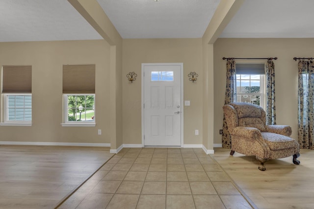 135 Tassel View St, Pataskala, OH 43062 - entryway with healthy amount of natural light, light wood-type flooring, and baseboards