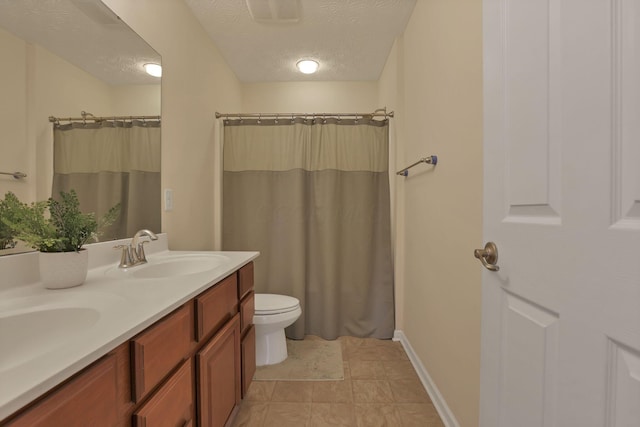 135 Tassel View St, Pataskala, OH 43062 - bathroom featuring a textured ceiling, double vanity, toilet, a shower with shower curtain, and baseboards