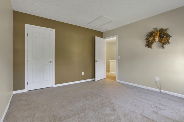135 Tassel View St, Pataskala, OH 43062 - unfurnished bedroom with attic access, baseboards, and carpet