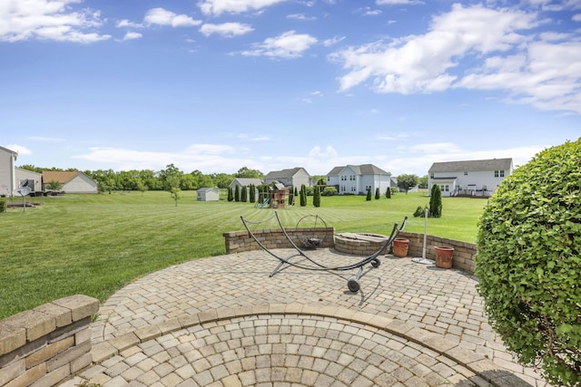 135 Tassel View St, Pataskala, OH 43062 - view of patio / terrace featuring a playground, an outdoor fire pit, and a residential view