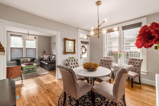 1105 Say Ave, Columbus, OH 43201 - dining room featuring light wood-type flooring and a chandelier