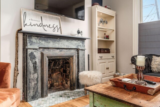 1105 Say Ave, Columbus, OH 43201 - detailed view of wood finished floors and a fireplace with flush hearth