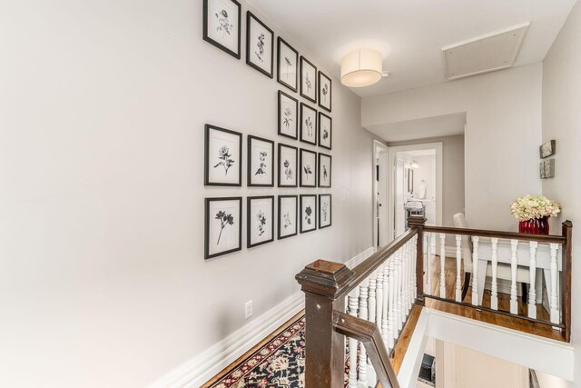 1105 Say Ave, Columbus, OH 43201 - corridor featuring an upstairs landing, baseboards, and attic access