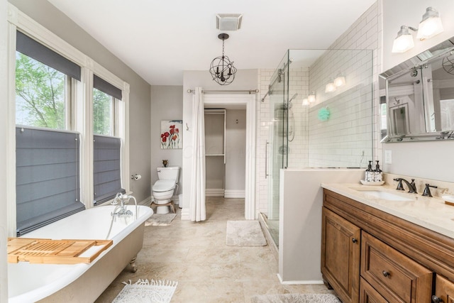 1105 Say Ave, Columbus, OH 43201 - bathroom featuring a stall shower, a soaking tub, vanity, toilet, and baseboards