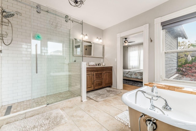 1105 Say Ave, Columbus, OH 43201 - ensuite bathroom featuring a shower stall, a freestanding tub, vanity, and ceiling fan