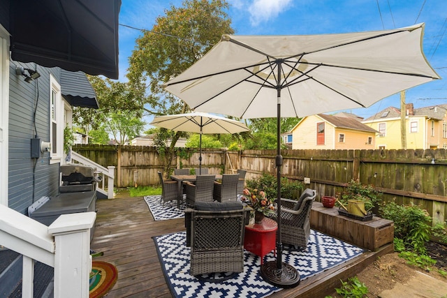 1105 Say Ave, Columbus, OH 43201 - wooden terrace with outdoor dining area and a fenced backyard