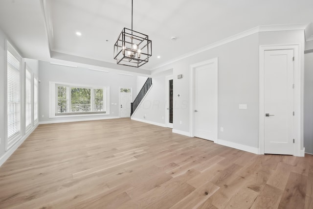 268 E Gay St Unit Th38, Columbus, OH 43215 - unfurnished living room featuring stairway, a chandelier, light wood-type flooring, baseboards, and crown molding