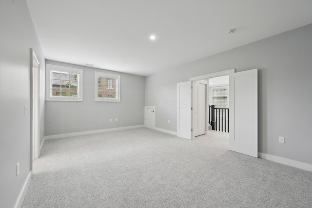 268 E Gay St Unit Th38, Columbus, OH 43215 - unfurnished bedroom with multiple windows and light colored carpet
