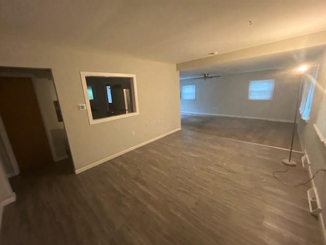 1227 Hart Rd, Columbus, OH 43223 - spare room featuring dark wood-style floors, baseboards, and a ceiling fan