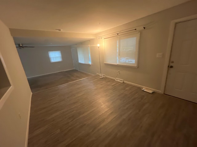 1227 Hart Rd, Columbus, OH 43223 - unfurnished room with dark wood finished floors, baseboards, and ceiling fan
