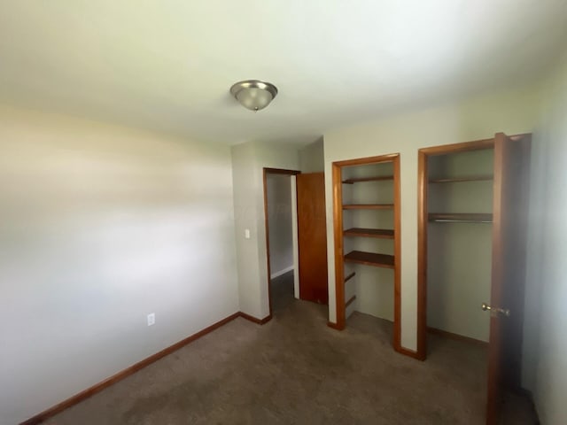 1227 Hart Rd, Columbus, OH 43223 - unfurnished bedroom with two closets, carpet, and baseboards