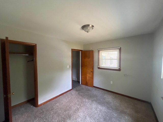 1227 Hart Rd, Columbus, OH 43223 - unfurnished bedroom featuring carpet floors, a closet, and baseboards