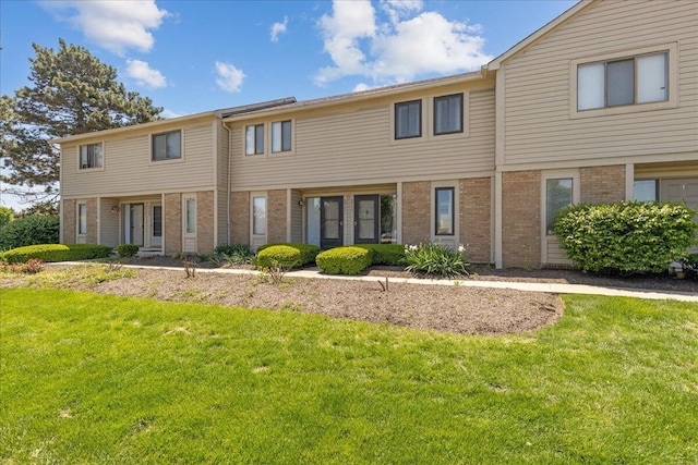 2713 Summer Dr, Dublin, OH 43016 - view of front facade with brick siding and a front lawn