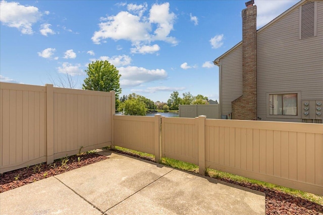 2713 Summer Dr, Dublin, OH 43016 - view of patio / terrace with fence and a water view